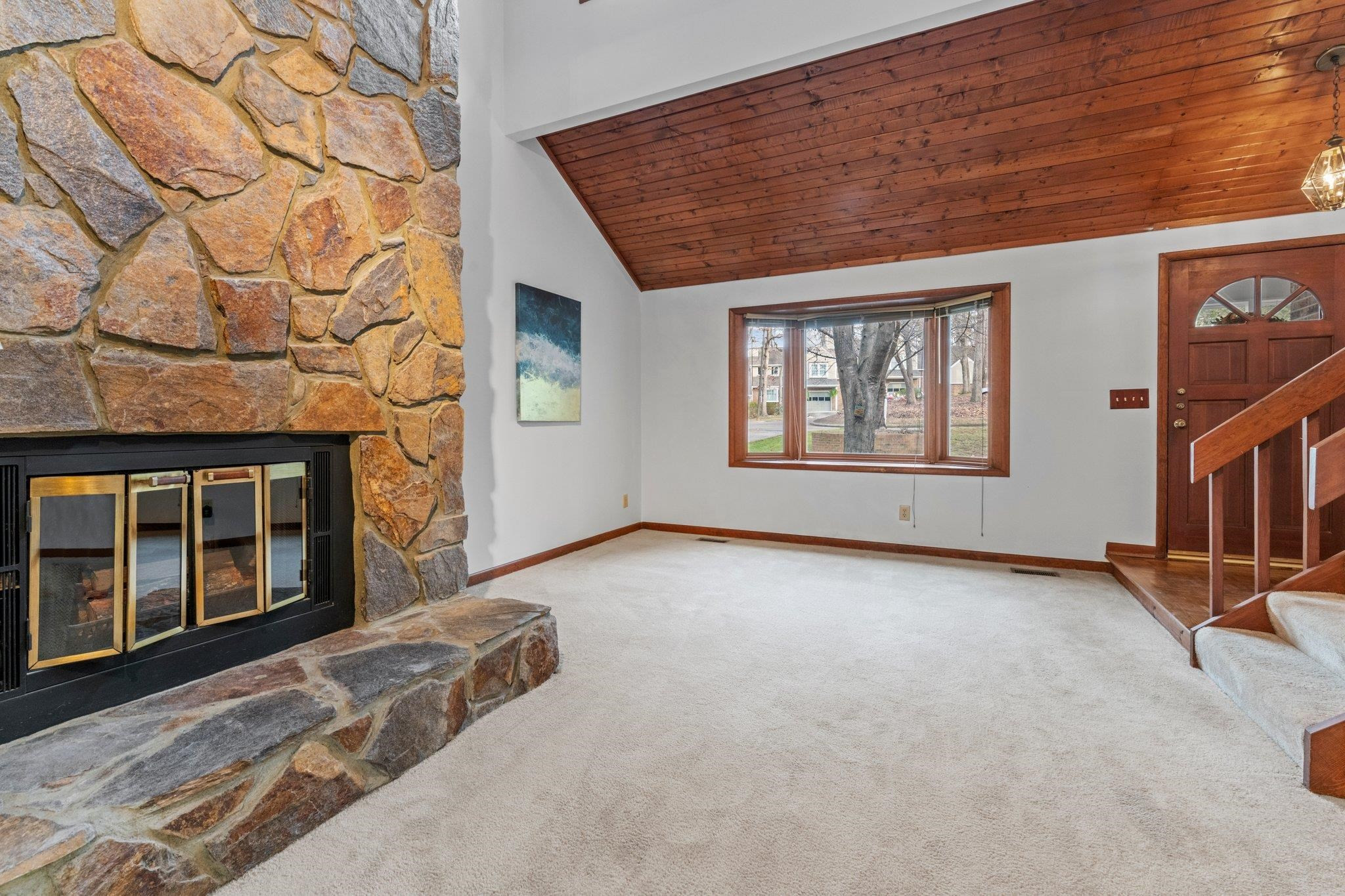 7829 Breckon Way Raleigh, NC 27615 - Photo 7 of 40 Family Room has fireplace and bay window with beautiful wood accent. Family Room