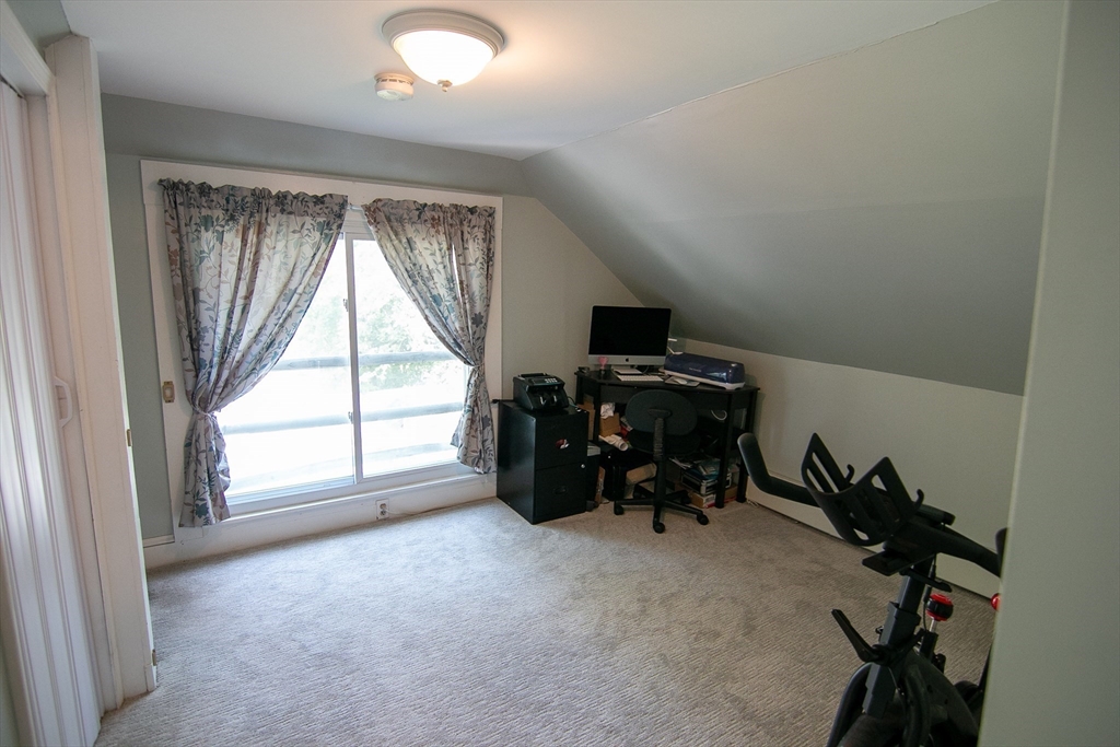 10 Makepeace Street Saugus, MA 01906 - Photo 14 of 36 a view of a room with gym equipment and a large window