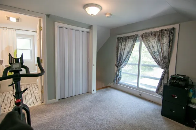 a view of room with windows and closet