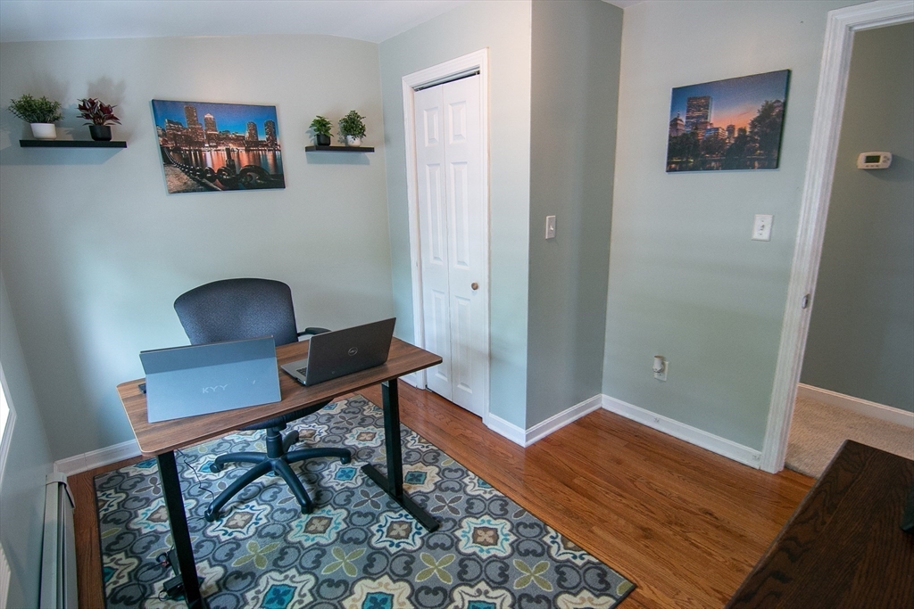 10 Makepeace Street Saugus, MA 01906 - Photo 19 of 36 a view of a workspace with furniture and wooden floor