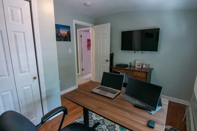 a laptop computer sitting on top of a desk