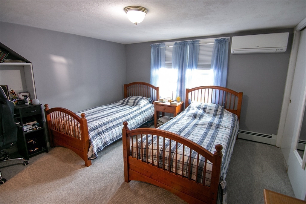 10 Makepeace Street Saugus, MA 01906 - Photo 21 of 36 a bedroom with two beds and a dresser
