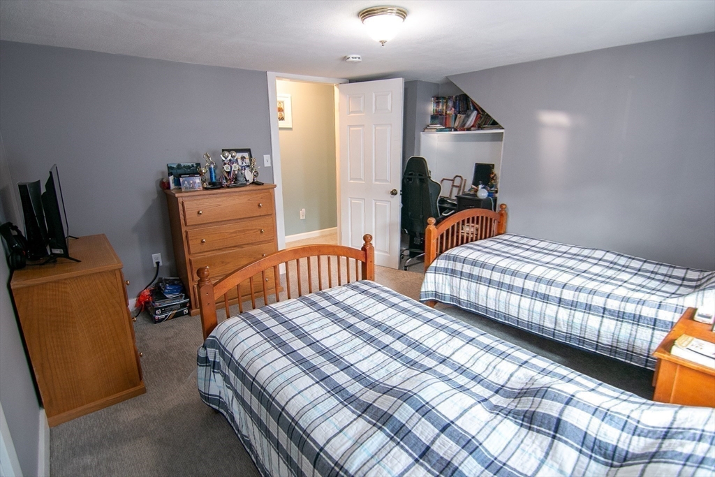 10 Makepeace Street Saugus, MA 01906 - Photo 22 of 36 a bedroom with two beds and a closet