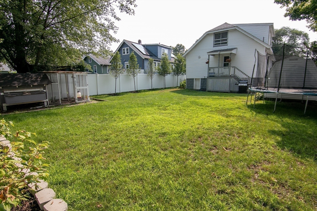 10 Makepeace Street Saugus, MA 01906 - Photo 30 of 36 a view of a house with a backyard