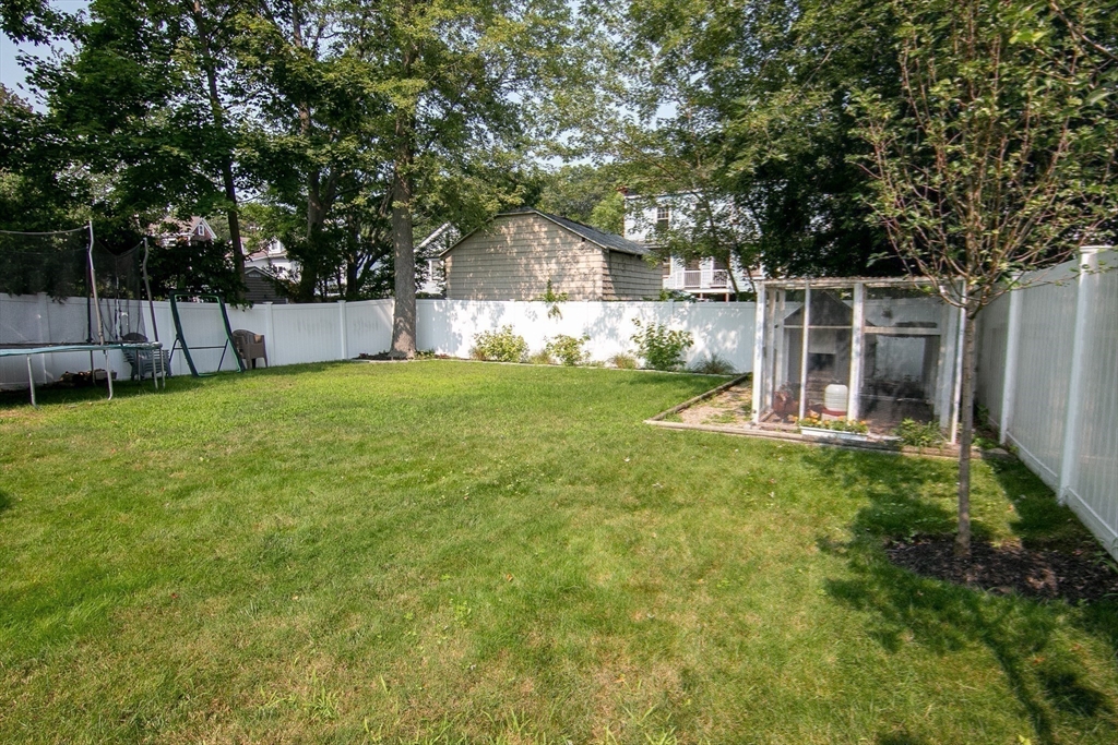 10 Makepeace Street Saugus, MA 01906 - Photo 31 of 36 a view of a house with backyard and sitting area