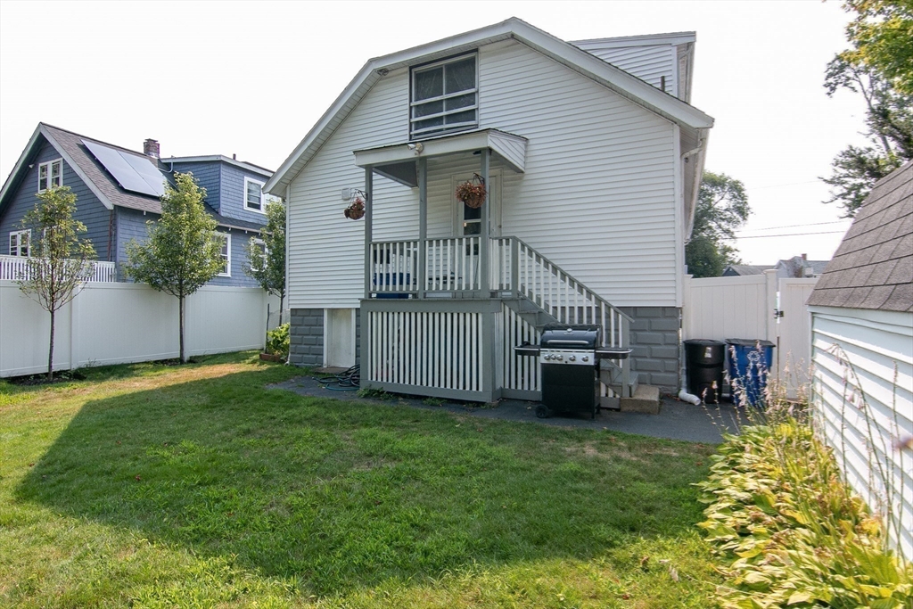 10 Makepeace Street Saugus, MA 01906 - Photo 32 of 36 a view of a house with a yard and deck