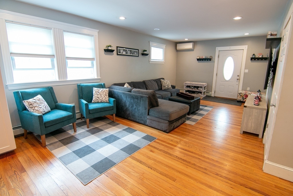 10 Makepeace Street Saugus, MA 01906 - Photo 9 of 36 a living room with furniture and a wooden floor