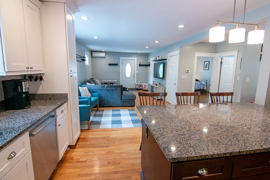 10 Makepeace Street Saugus, MA 01906 - Photo 10 of 36 a large kitchen with kitchen island a large counter top and stainless steel appliances