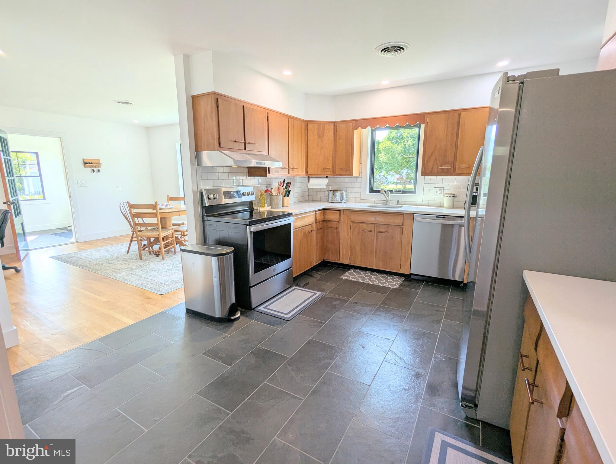 504 Main Street Stevensville, MD 21666 - Photo 13 of 30 a kitchen with a stove a sink and a refrigerator