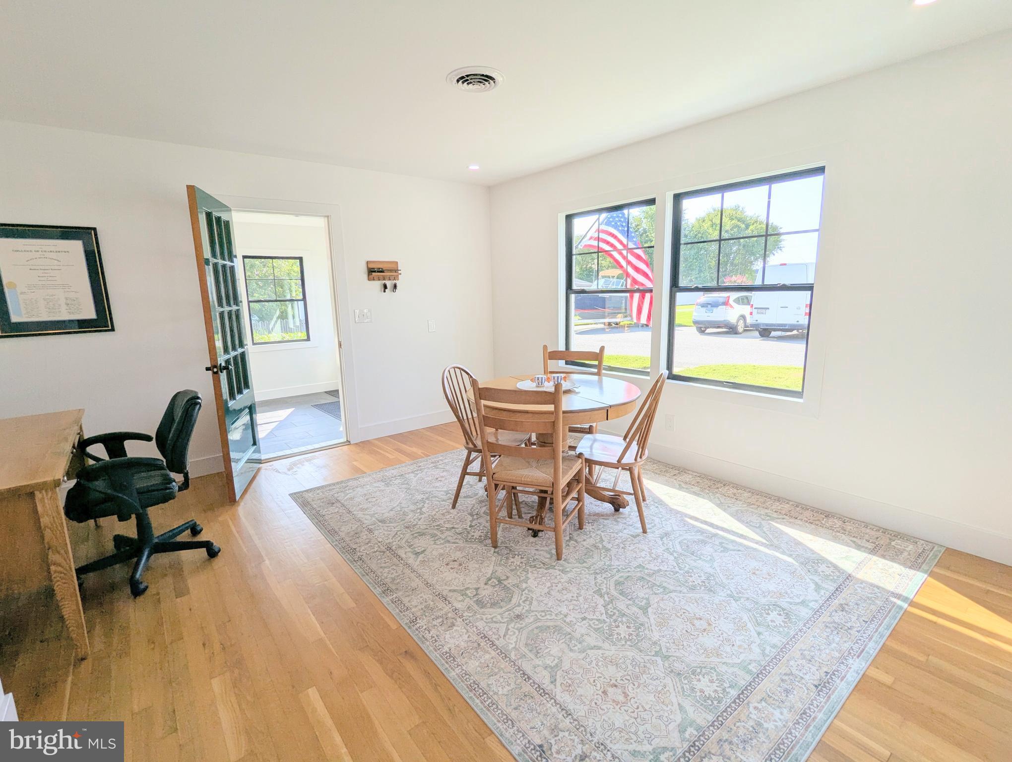 504 Main Street Stevensville, MD 21666 - Photo 14 of 30 a workspace with wooden floor