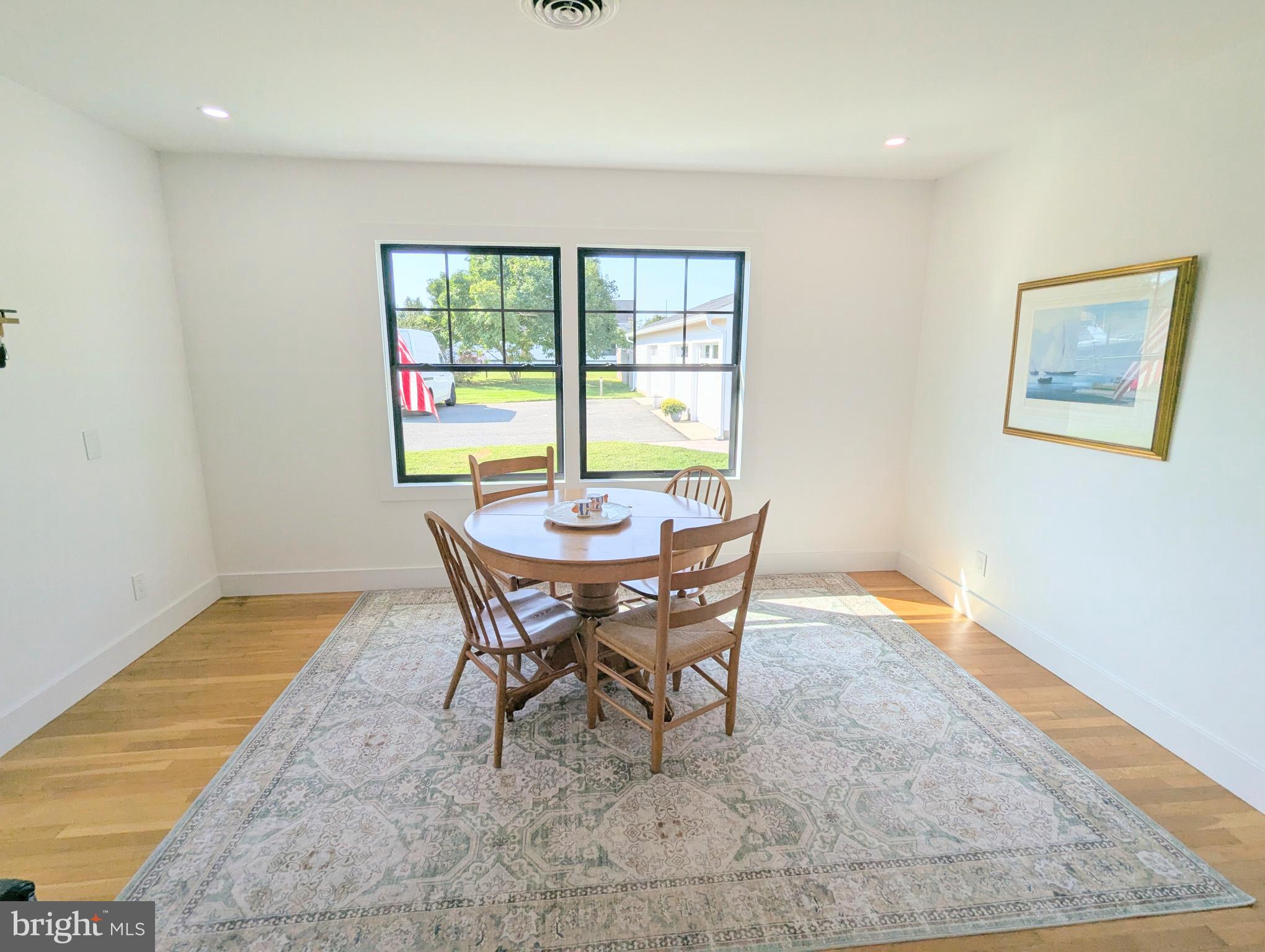 504 Main Street Stevensville, MD 21666 - Photo 16 of 30 a view of a dining room with furniture and a window