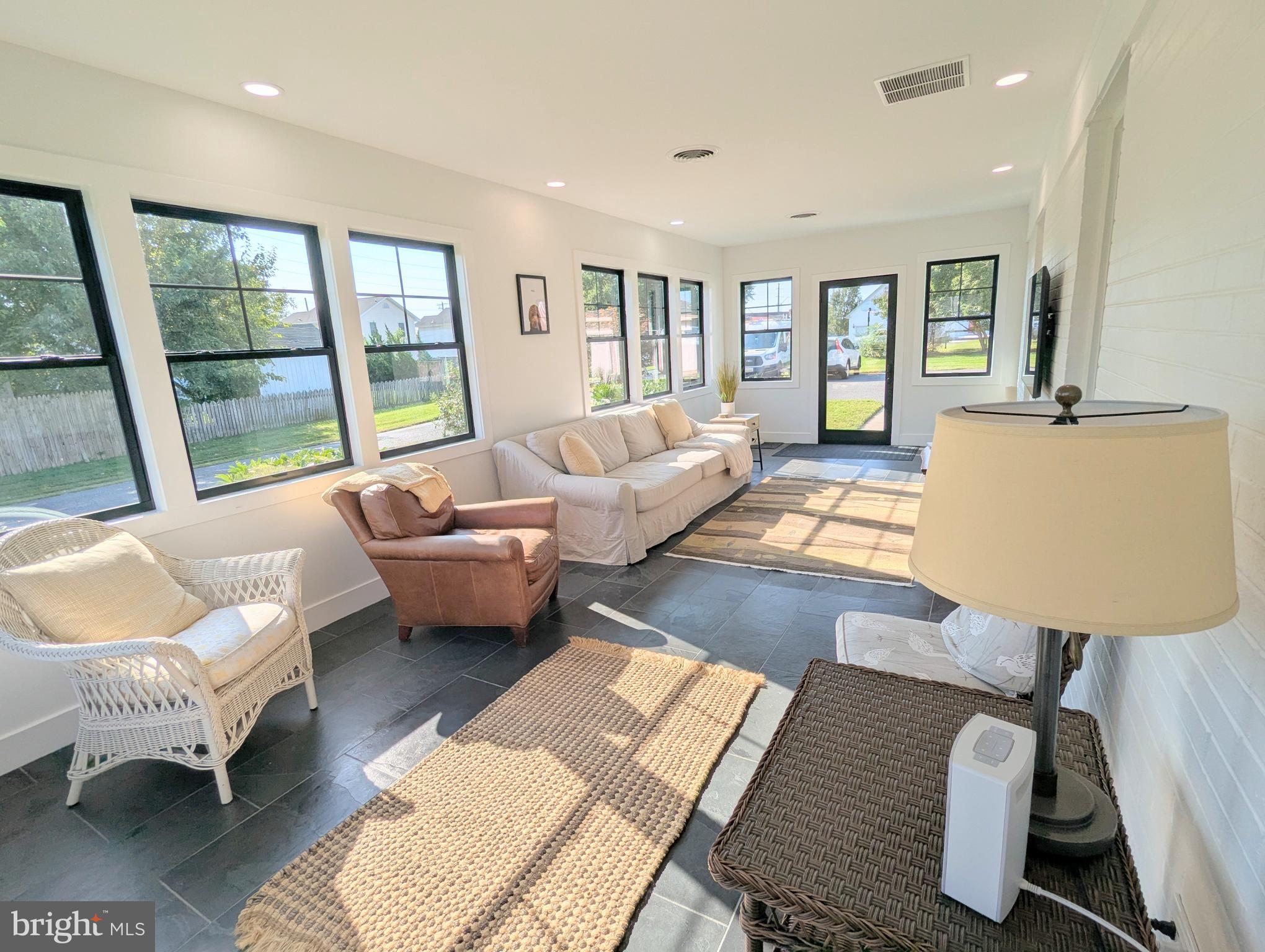 504 Main Street Stevensville, MD 21666 - Photo 2 of 30 a living room with furniture and a couch