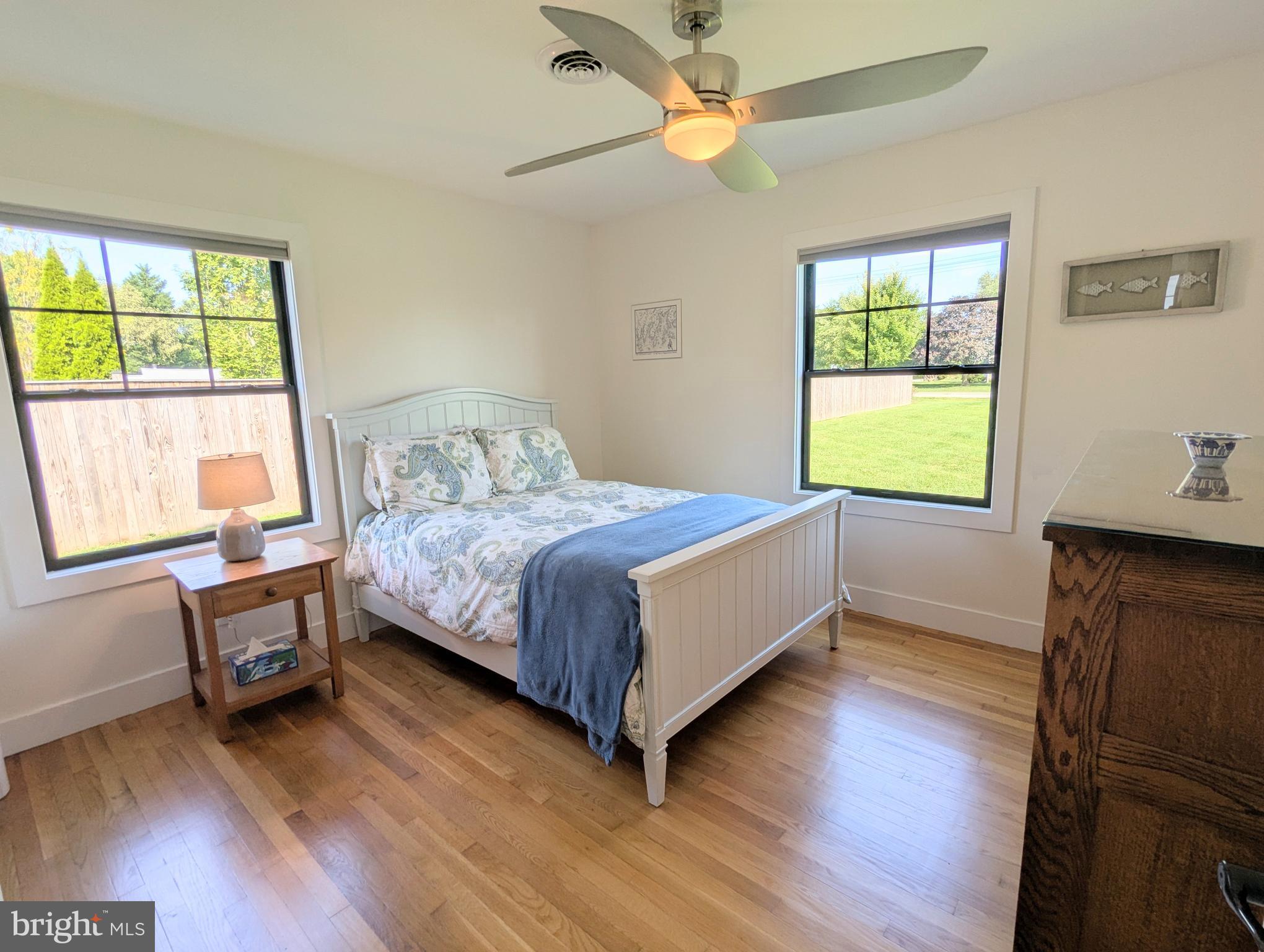 504 Main Street Stevensville, MD 21666 - Photo 21 of 30 a bedroom with a bed and a window