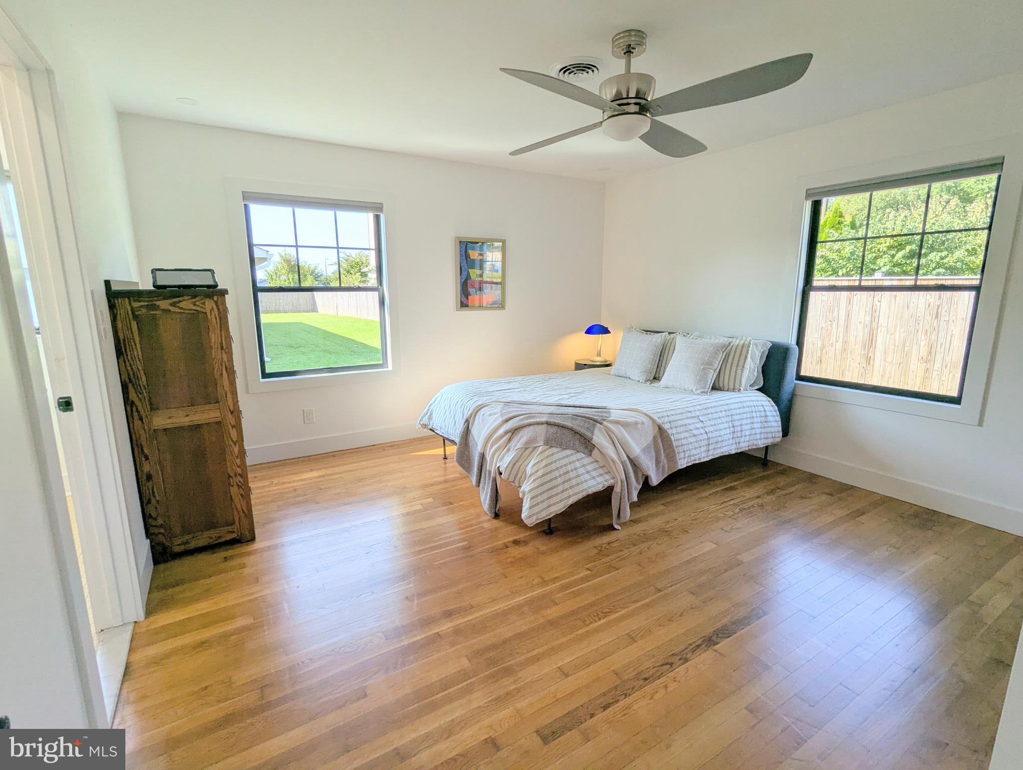 504 Main Street Stevensville, MD 21666 - Photo 23 of 30 a bedroom with a bed furniture and a window