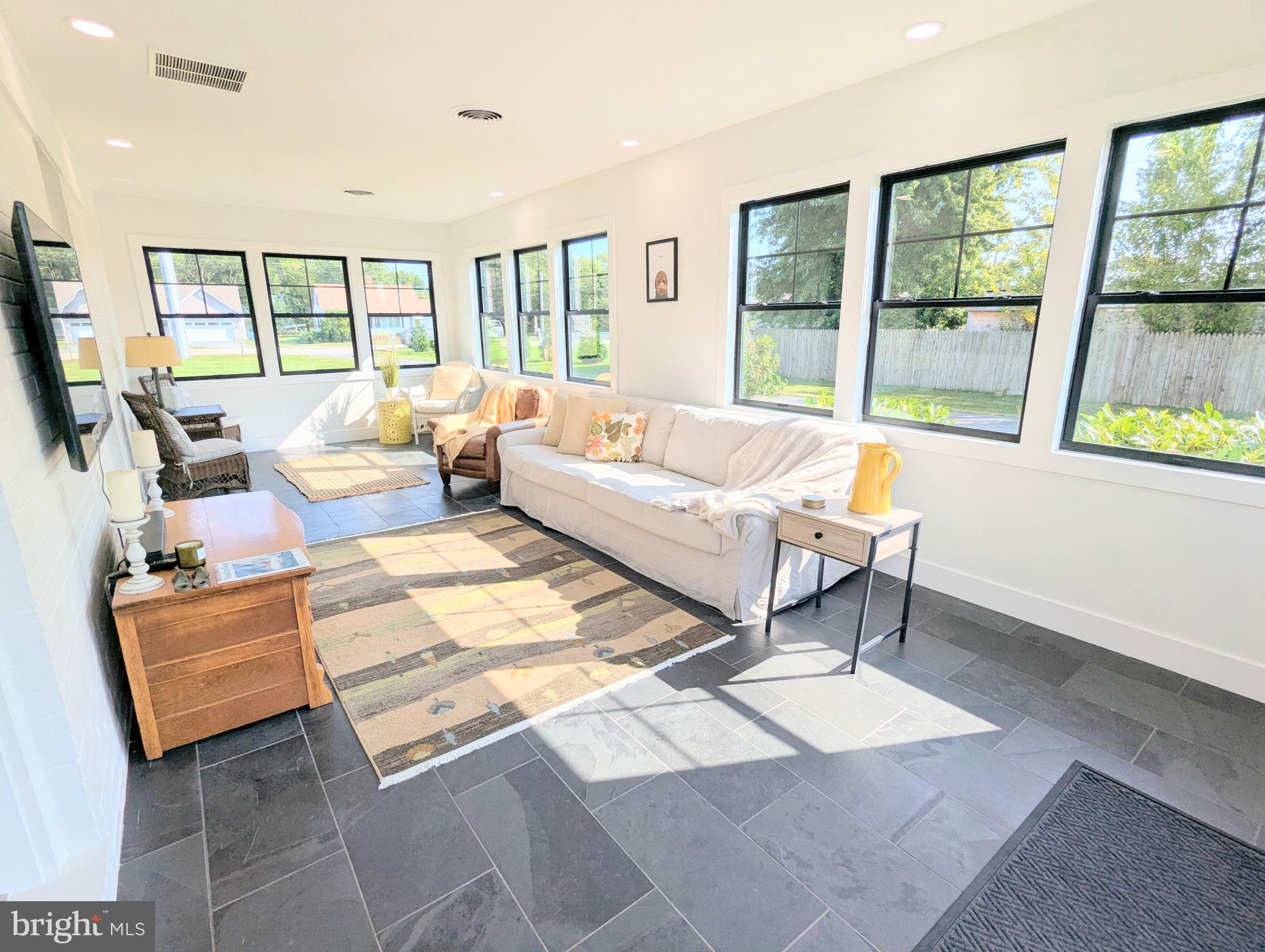504 Main Street Stevensville, MD 21666 - Photo 4 of 30 a living room with furniture and a large window