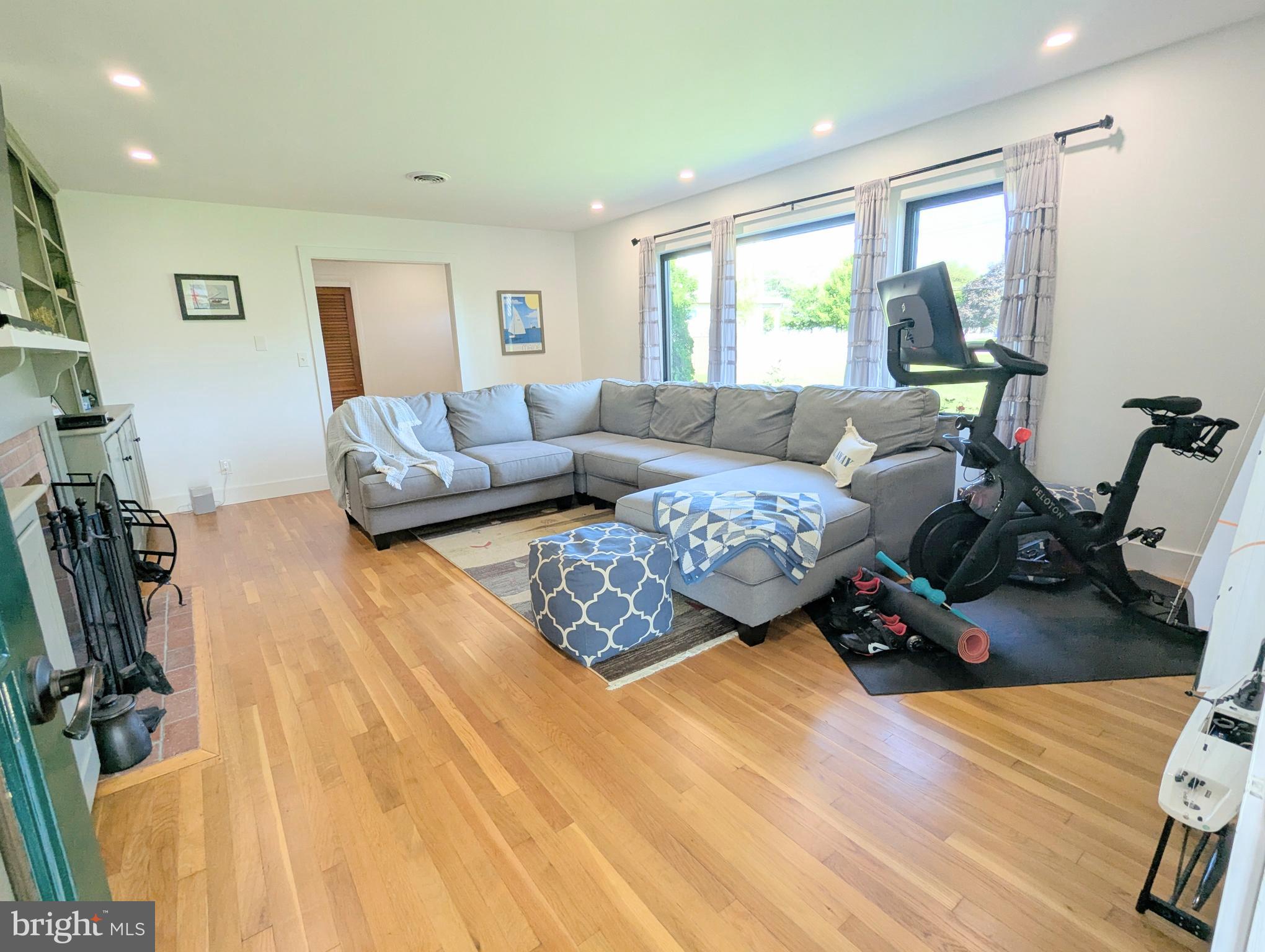 504 Main Street Stevensville, MD 21666 - Photo 6 of 30 a bedroom with furniture and a wooden floor
