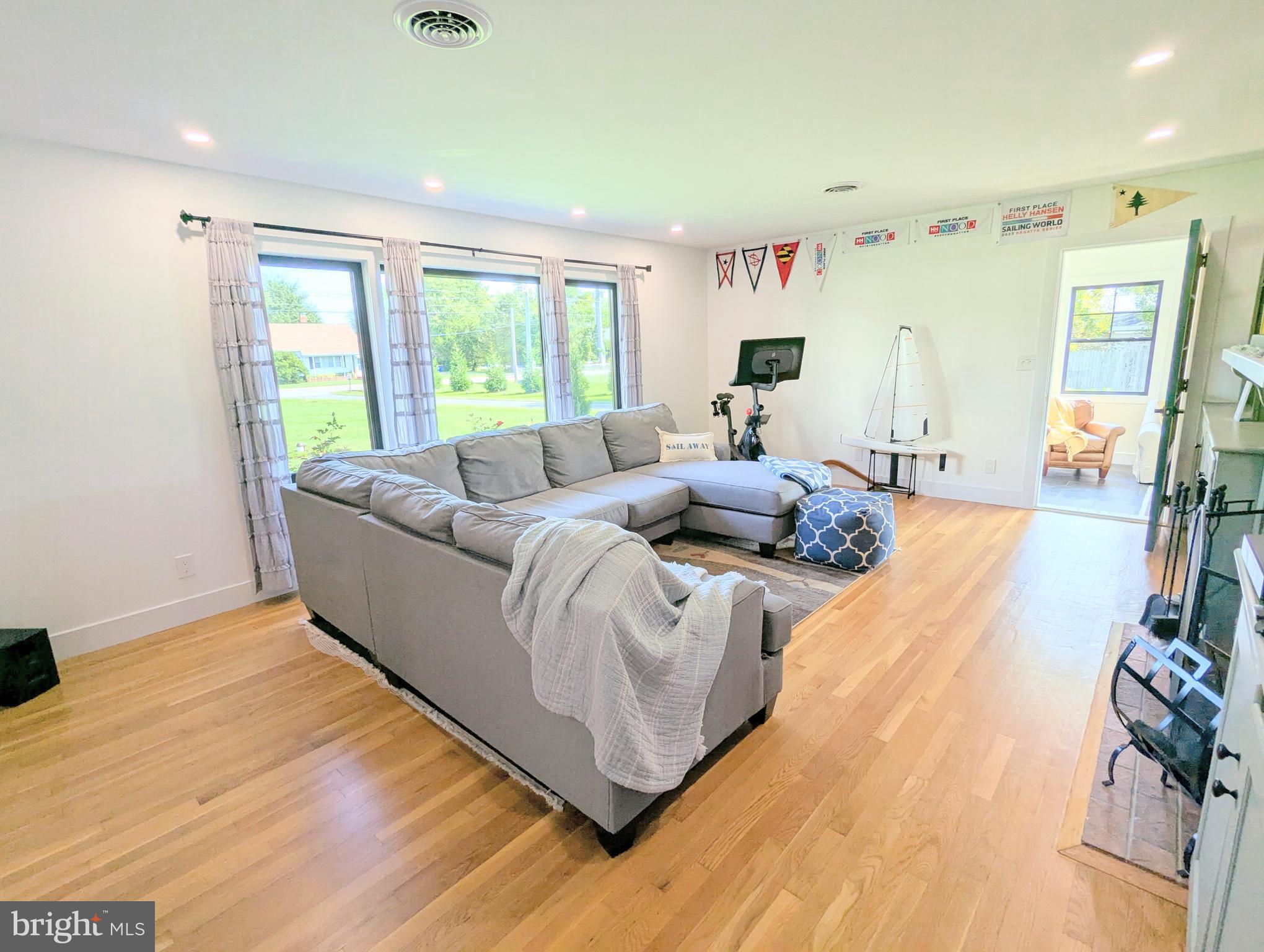 504 Main Street Stevensville, MD 21666 - Photo 7 of 30 a living room with furniture and a large window
