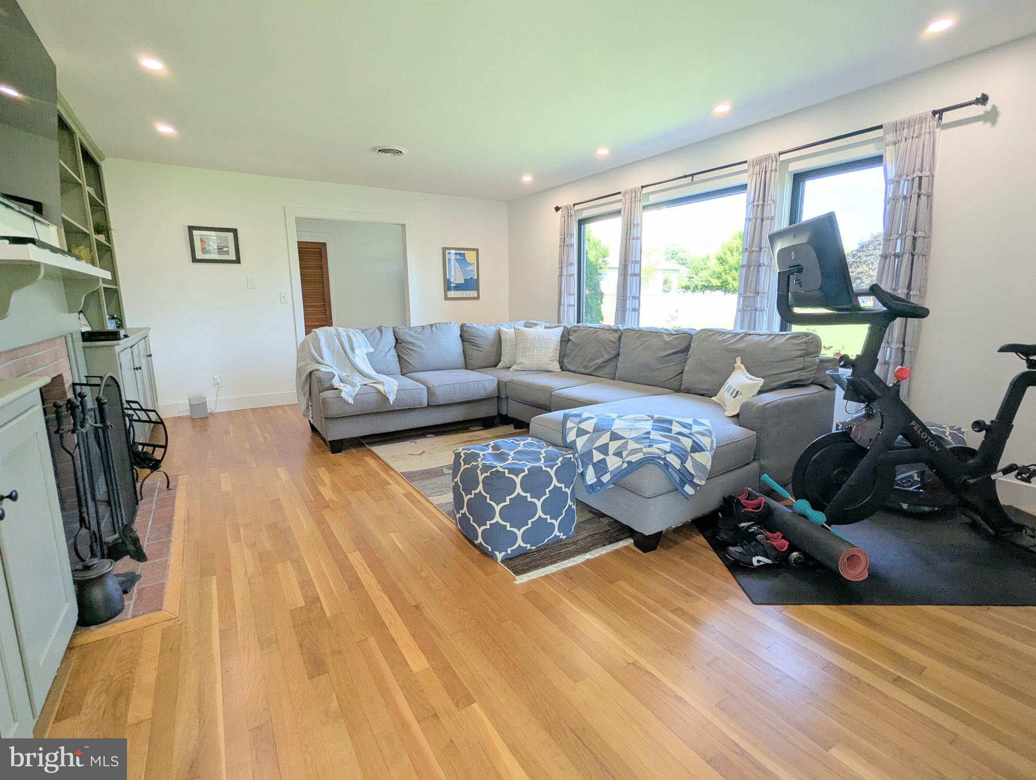 504 Main Street Stevensville, MD 21666 - Photo 9 of 30 a living room with furniture window and a wooden floor