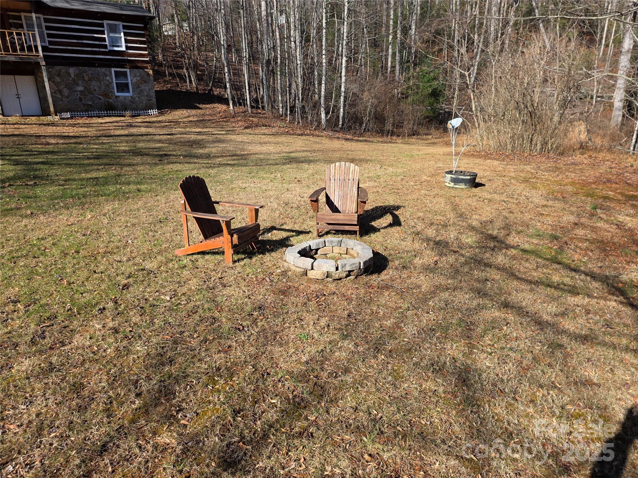 536 Hickory Springs Road Burnsville, NC 28714 - Photo 25 of 26 a view of a lake with a bench and trees