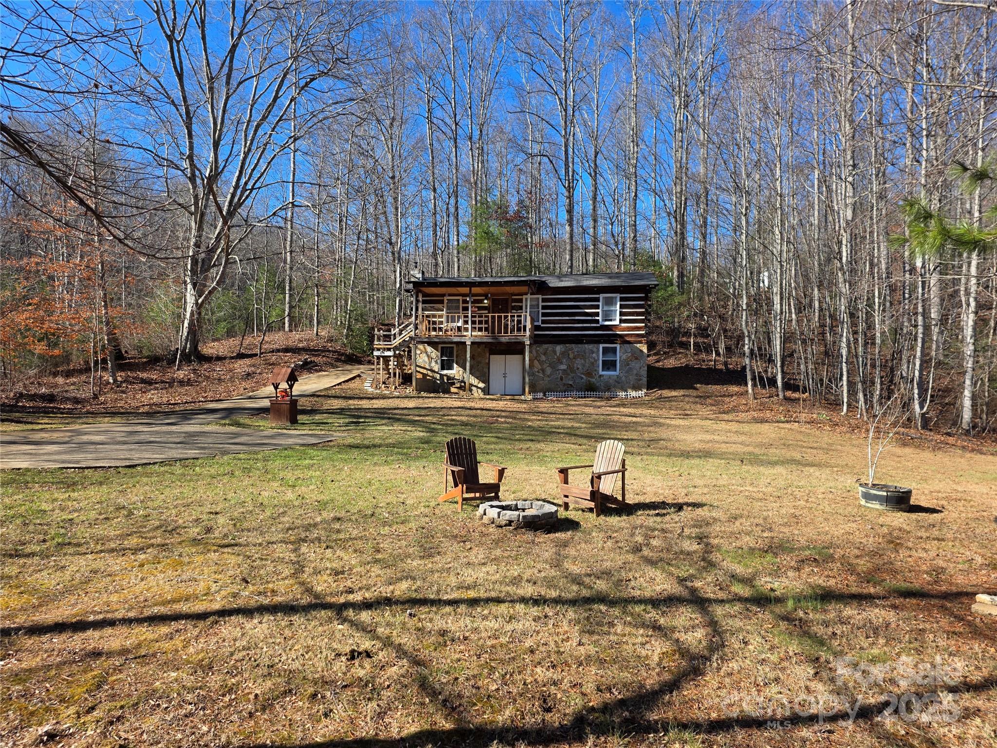 536 Hickory Springs Road Burnsville, NC 28714 - Photo 4 of 26 a view of pool with lawn chairs and trees