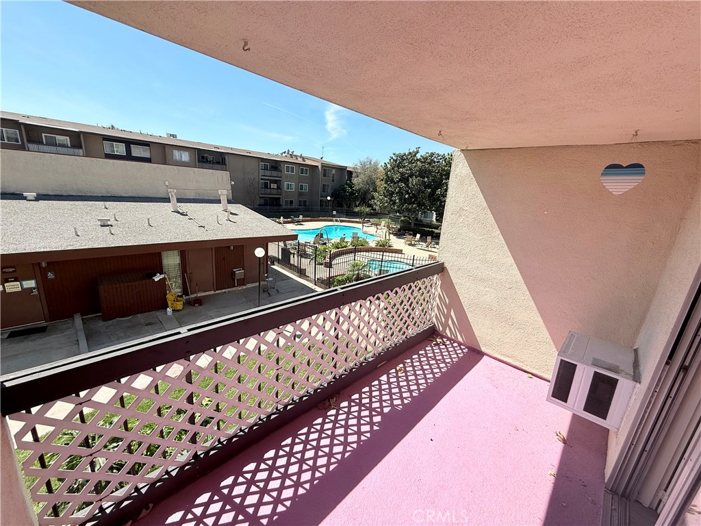12200 Montecito Road, Unit D221 Seal Beach, CA 90740 - Photo 11 of 25 Pool and green belt views off balcony…
