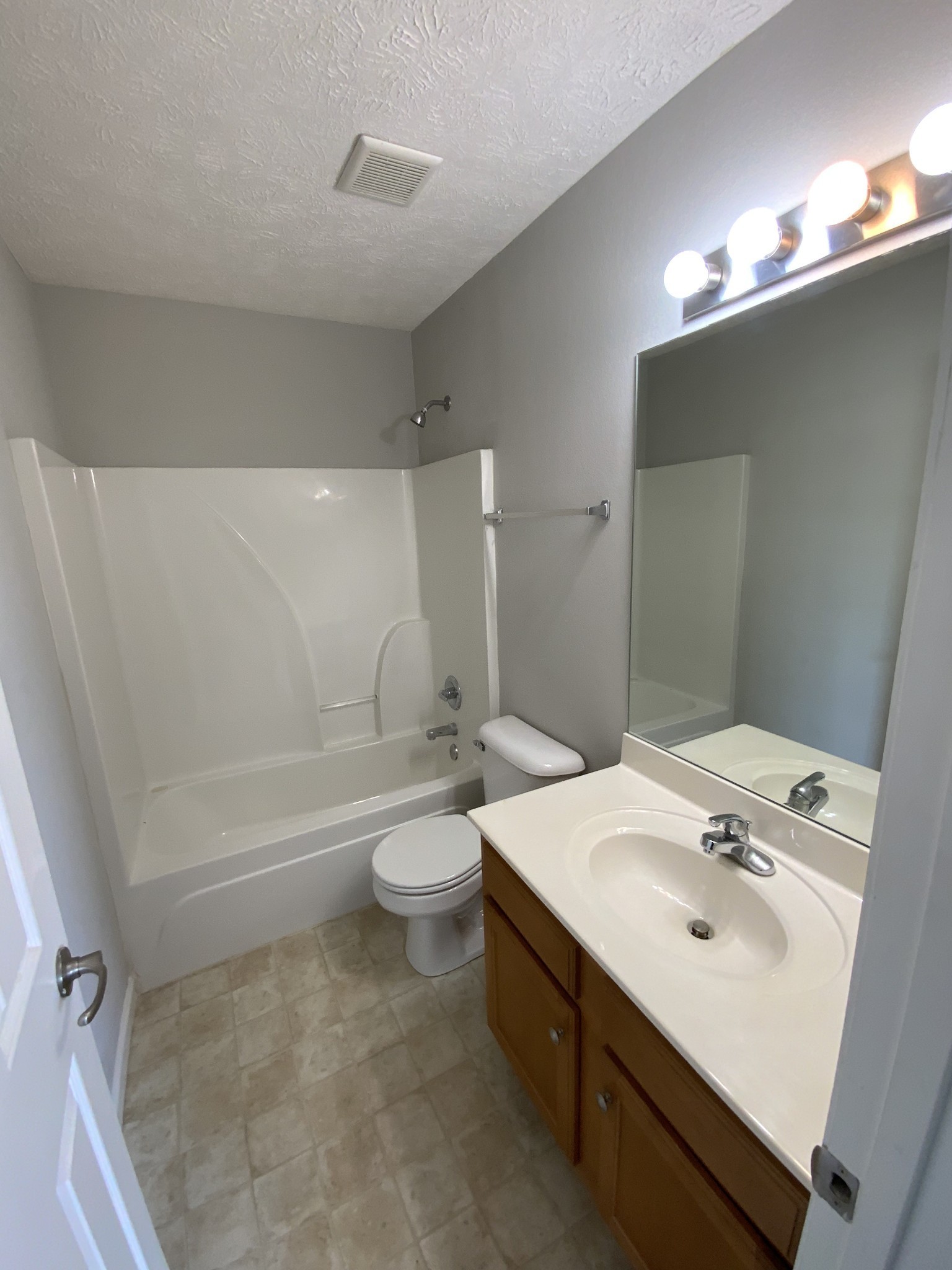2414 Tour Drive Murfreesboro, TN 37130 - Photo 13 of 14 a bathroom with a sink a toilet and shower