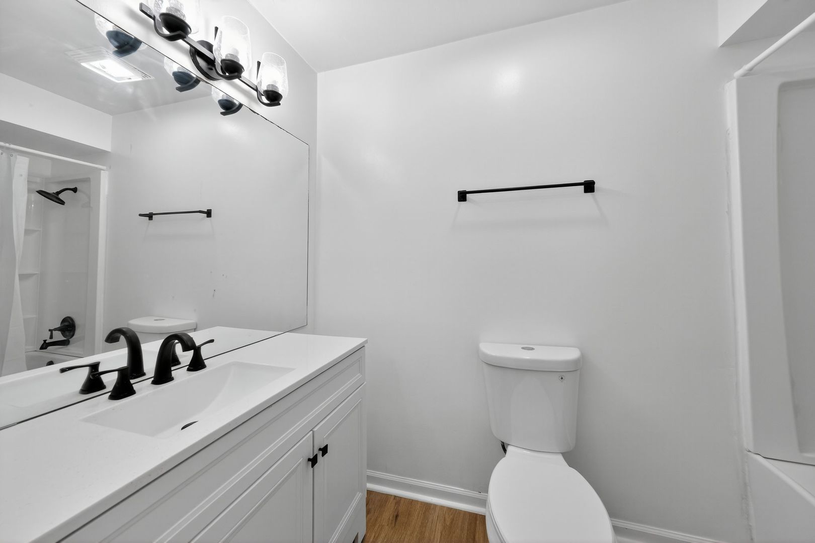 7501 Cambridge Road Darien, IL 60561 - Photo 14 of 22 a bathroom with a sink a toilet and mirror