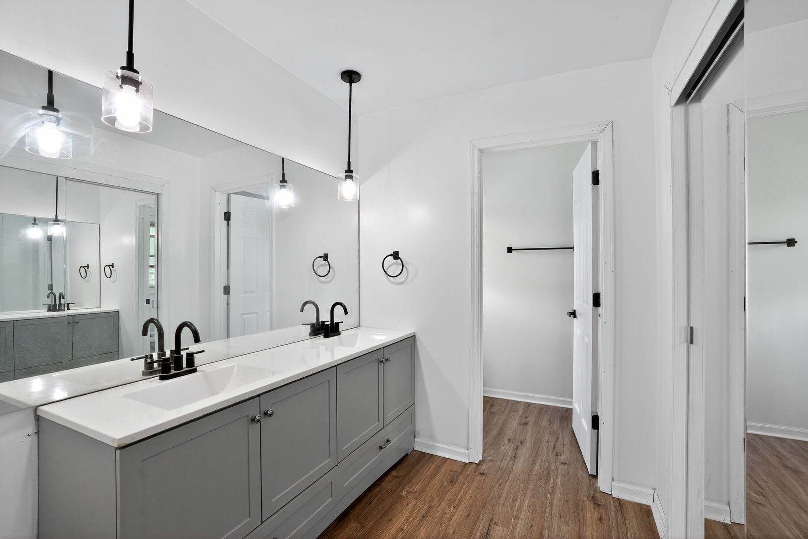 7501 Cambridge Road Darien, IL 60561 - Photo 15 of 22 a bathroom with a double vanity sink a mirror and a shower