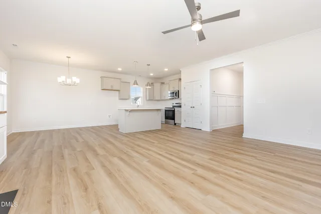 a view of a kitchen with a sink and a refrigerator