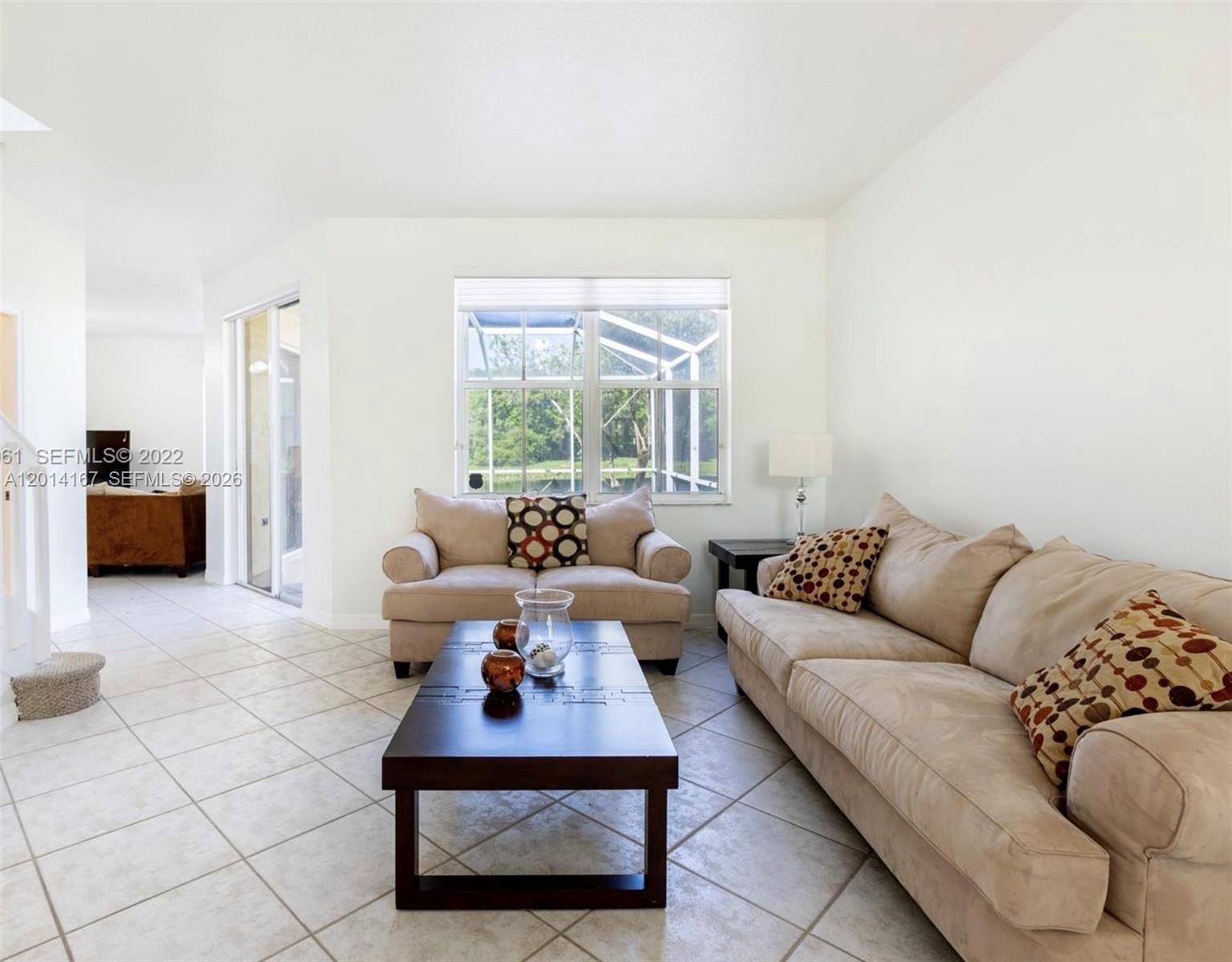 618 Willow Bend Road, Unit 618 Weston, FL 33327 - Photo 4 of 9 a living room with furniture and a window