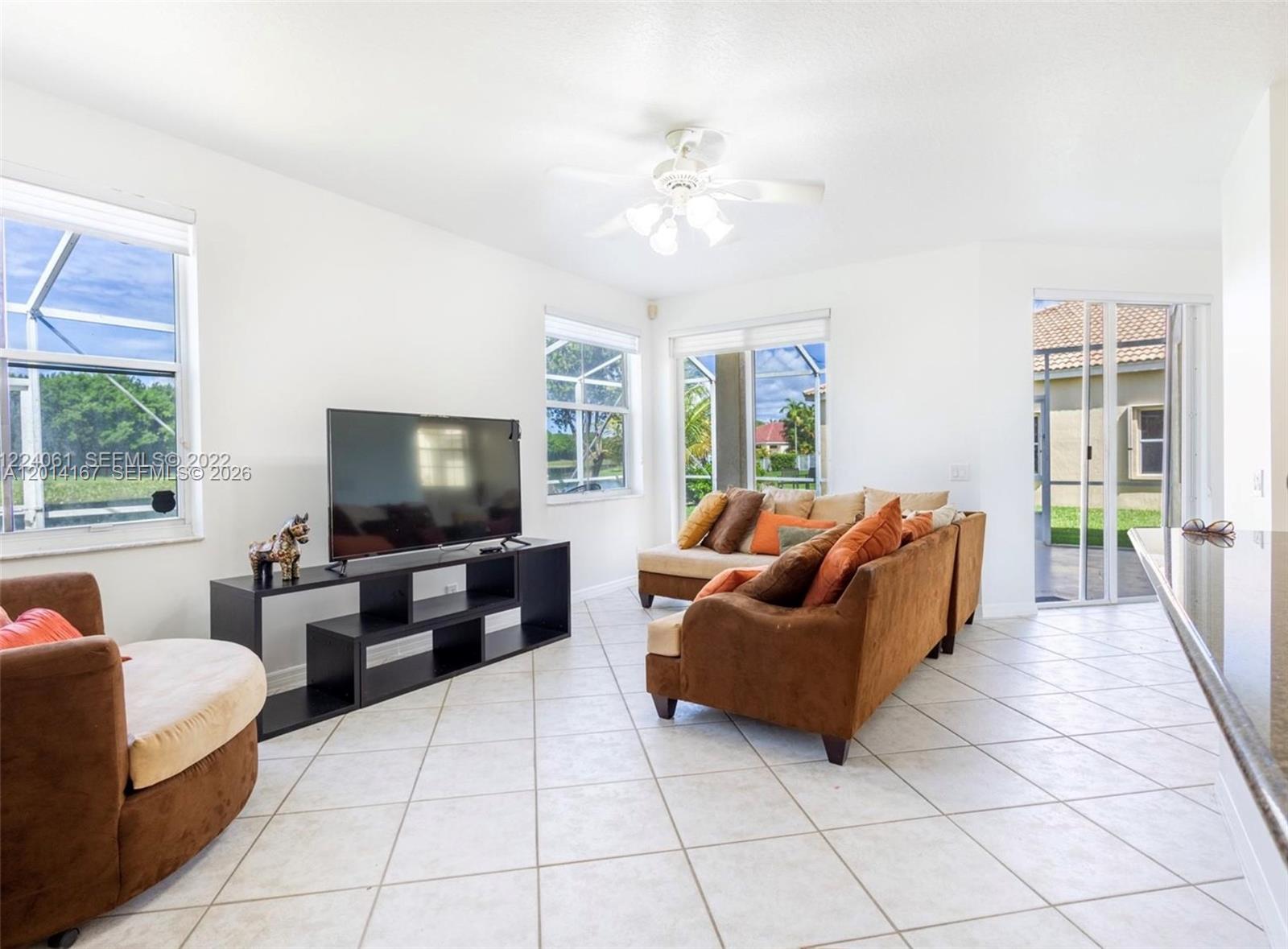 618 Willow Bend Road, Unit 618 Weston, FL 33327 - Photo 5 of 9 a living room with furniture and a flat screen tv