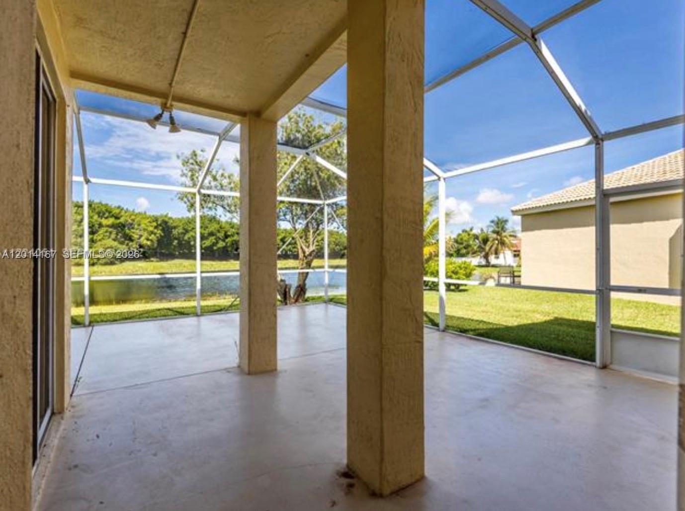 618 Willow Bend Road, Unit 618 Weston, FL 33327 - Photo 7 of 9 a view of a room with porch and a patio