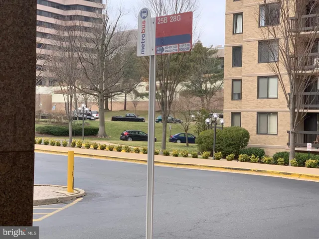 a living room with a large bed and a large window