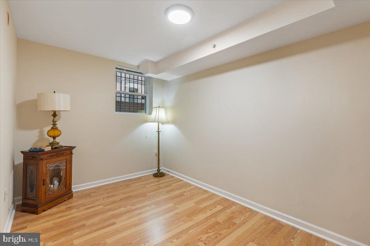 1458 Columbia Road Northwest, Unit 105 Washington, DC 20009 - Photo 14 of 39 a view of empty room with wooden floor