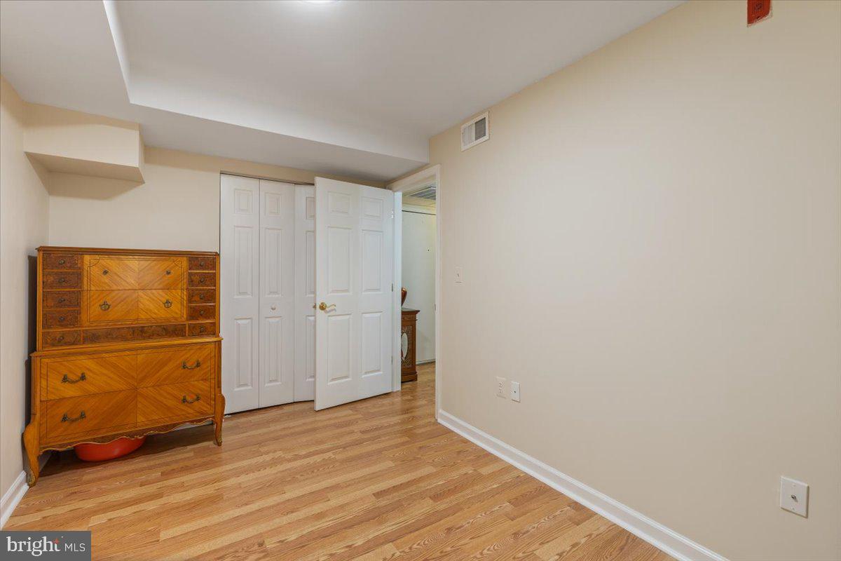 1458 Columbia Road Northwest, Unit 105 Washington, DC 20009 - Photo 15 of 39 wooden floor in an empty room