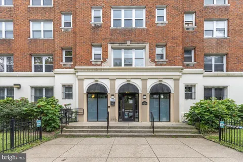 a front view of a building with garden