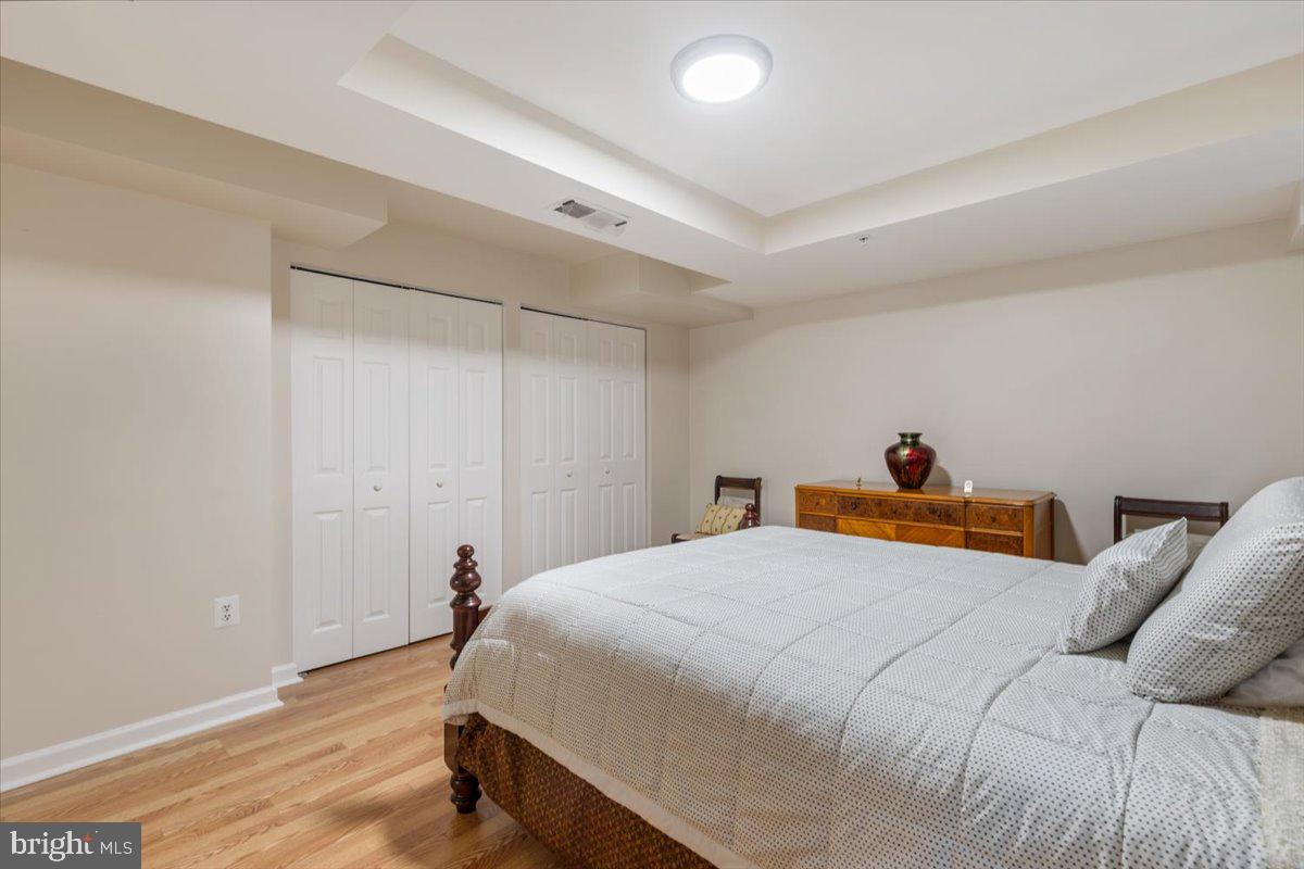 1458 Columbia Road Northwest, Unit 105 Washington, DC 20009 - Photo 21 of 39 a bedroom with a bed and a table