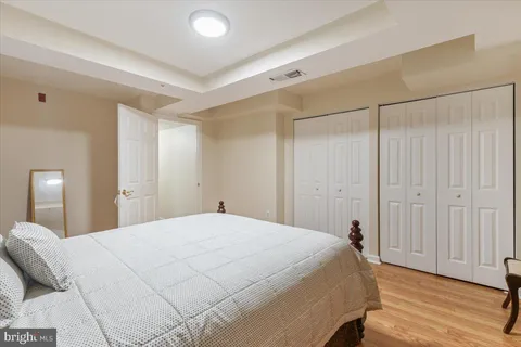 a large white bed in a white room