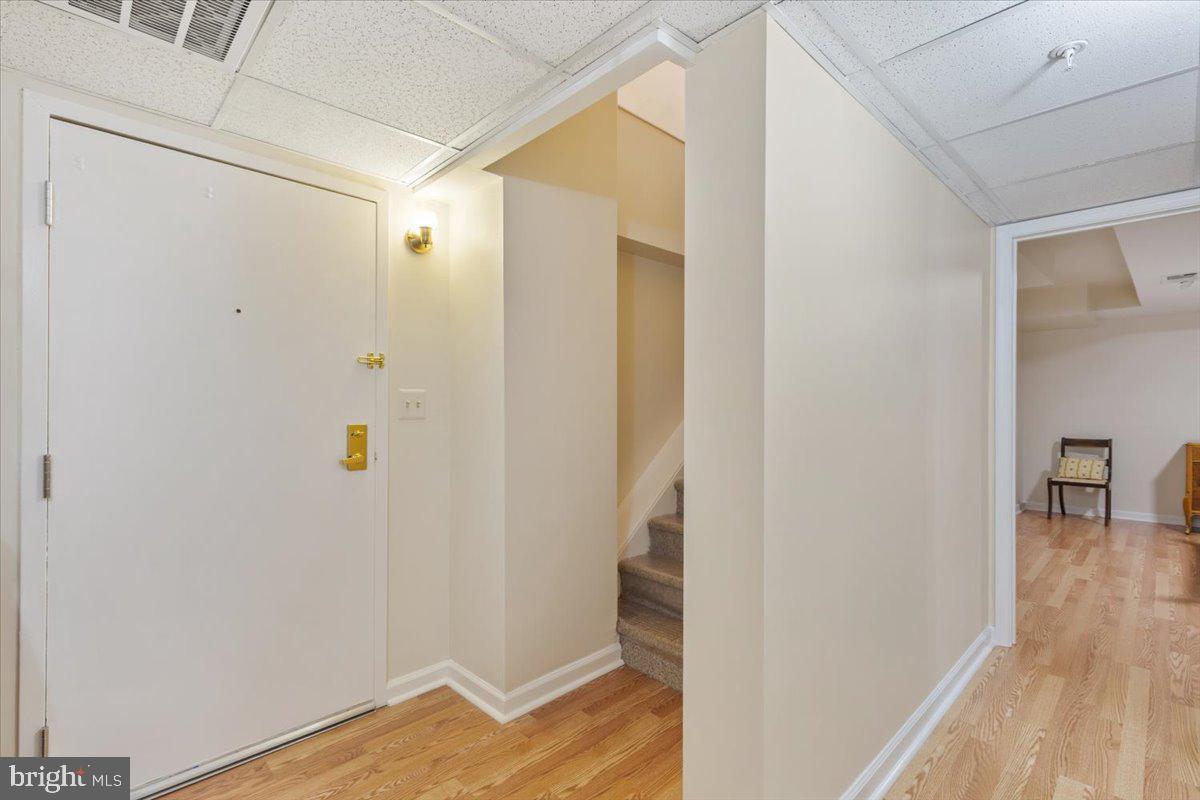1458 Columbia Road Northwest, Unit 105 Washington, DC 20009 - Photo 24 of 39 a view of a hallway with wooden floor