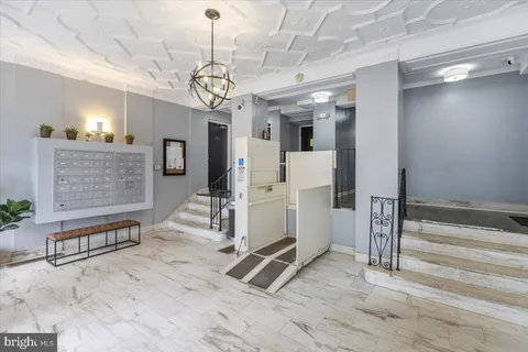 a view of hall way with furniture