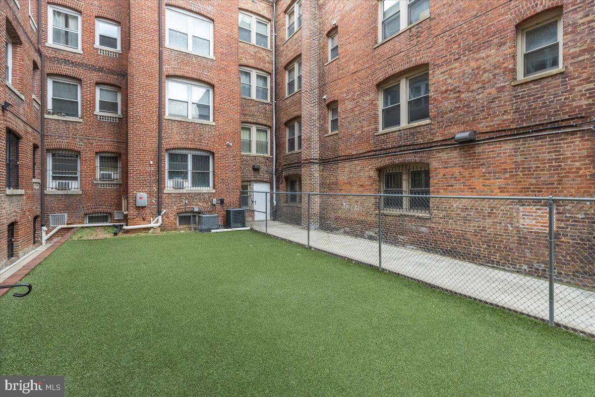 1458 Columbia Road Northwest, Unit 105 Washington, DC 20009 - Photo 29 of 39 a view of a house with a yard