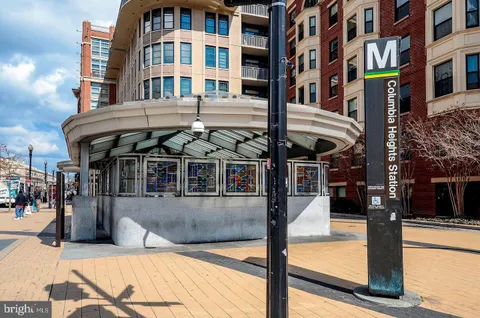 a front view of a building with a swimming pool