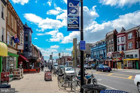 a city street lined with tall buildings