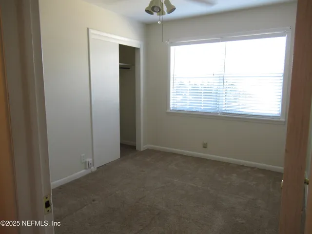 an empty room that has a window