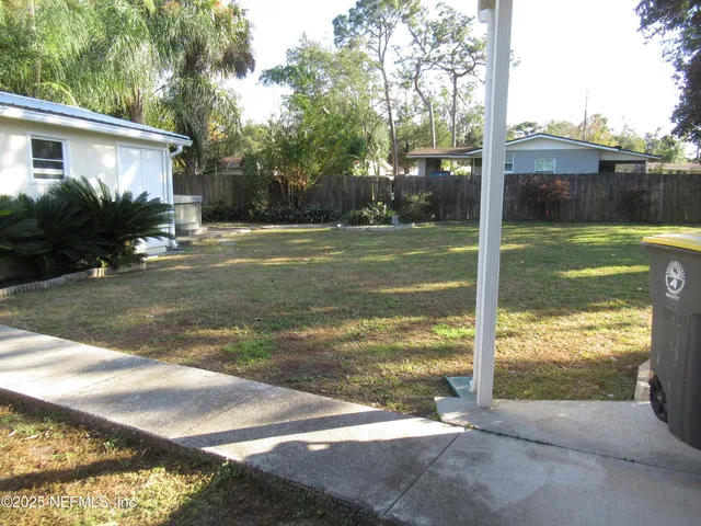 a view of a patio with a yard