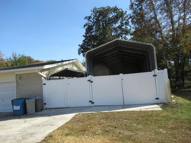 a backyard of a house with lots of green space