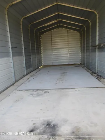 a view of an empty room with a balcony