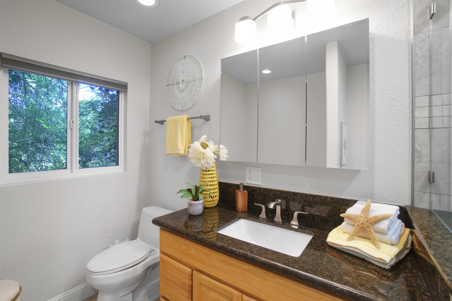 6299 Horseshoe Bar Road Loomis, CA 95650 - Photo 22 of 43 a bathroom with a granite countertop sink mirror vanity and toilet