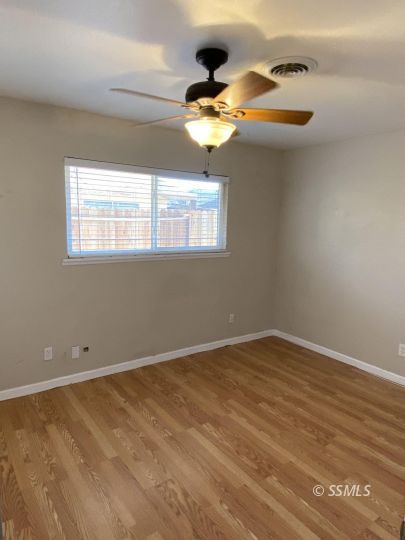 1037 West St George Avenue Ridgecrest, CA 93555 - Photo 5 of 8 a view of empty room with window