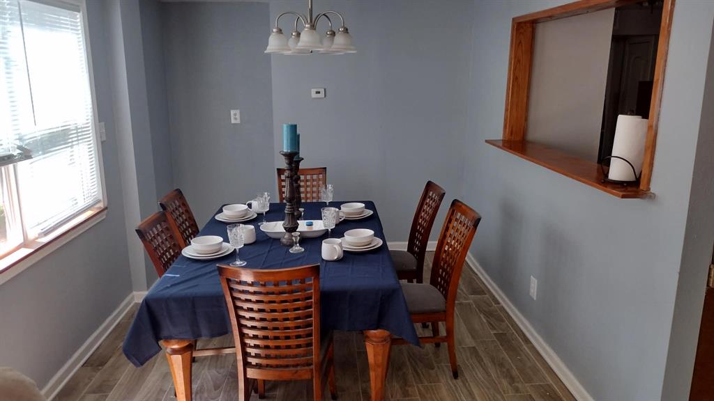 304 Ridgewood Drive Tool, TX 75143 - Photo 8 of 12 Dining space with wood finish floors and baseboards